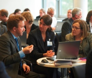 KAN employee Dr Michael Thierbach exchanges views with other conference participants.