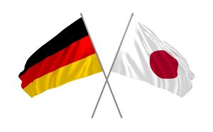 Sich kreuzende Deutschland und Japan Flagge
