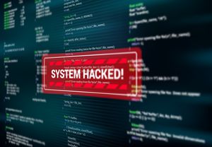 Message d'alerte rouge "System hacked" sur un écran d'ordinateur