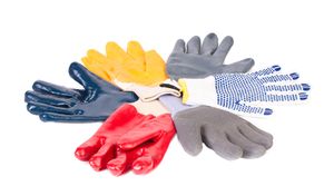 Protective gloves of different types and colours arranged in a circle