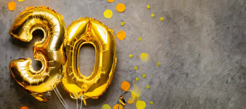 Golden foil balloons in the shape of a 30