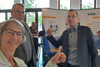 Bernhard Wagner, Ben Pfalz und Brigitta Hempel vor dem Messestand der KAN auf der Arbeitsschutz Konferenz in Reutlingen.