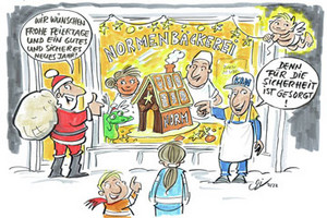 Die Weihnachtskarte zeit das Schaufenster einer Normenbäckerei mit einem nach Norm gebauten Lebkuchenhaus. Für die Sicherheit hat u.a. die KAN gesorgt.